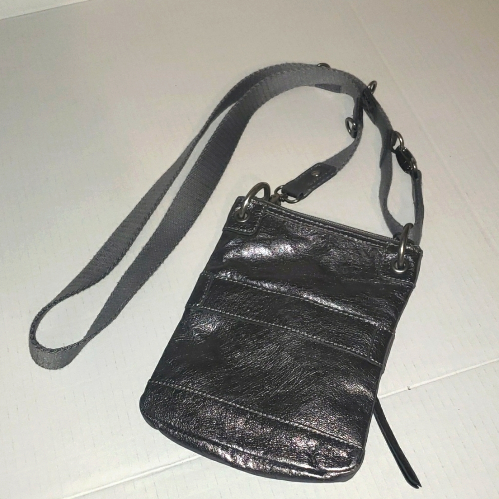 The SAK metallic silver leather crossbody concert minimalist staple bag